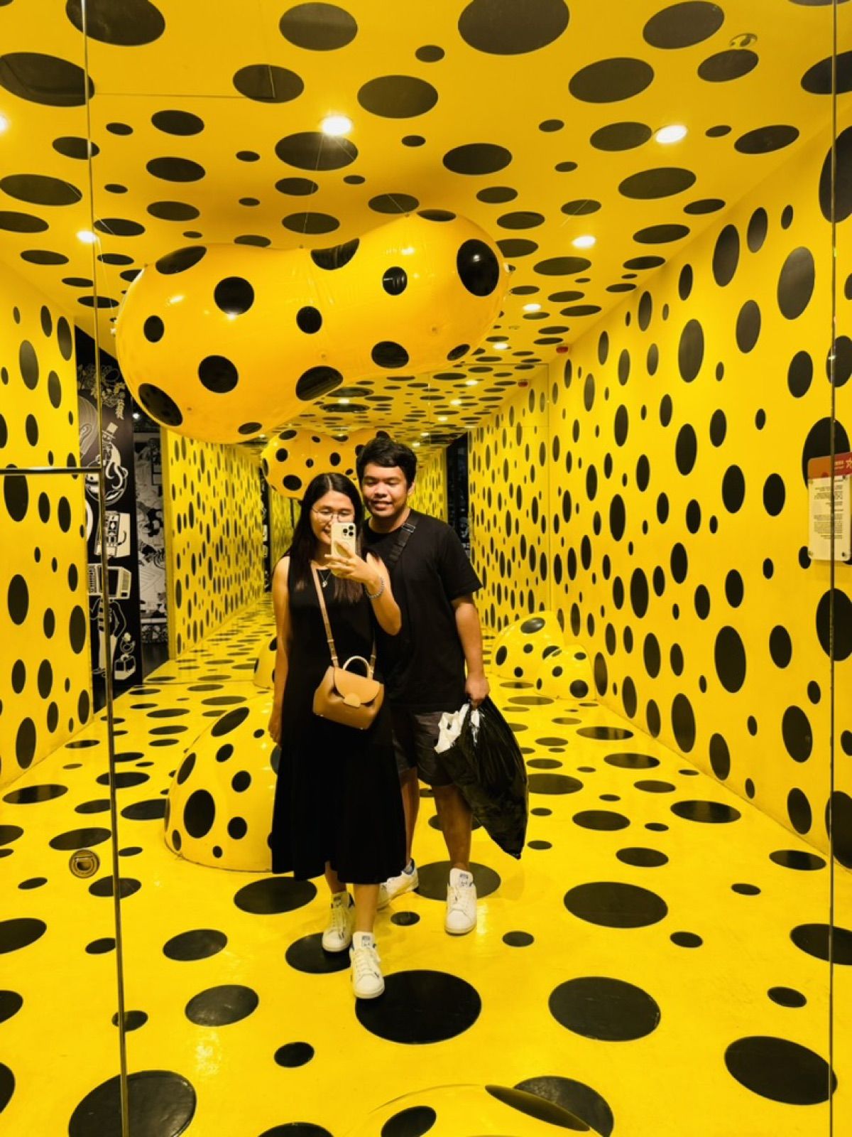 Allanaire and Honhie in a yellow polka-dot art room