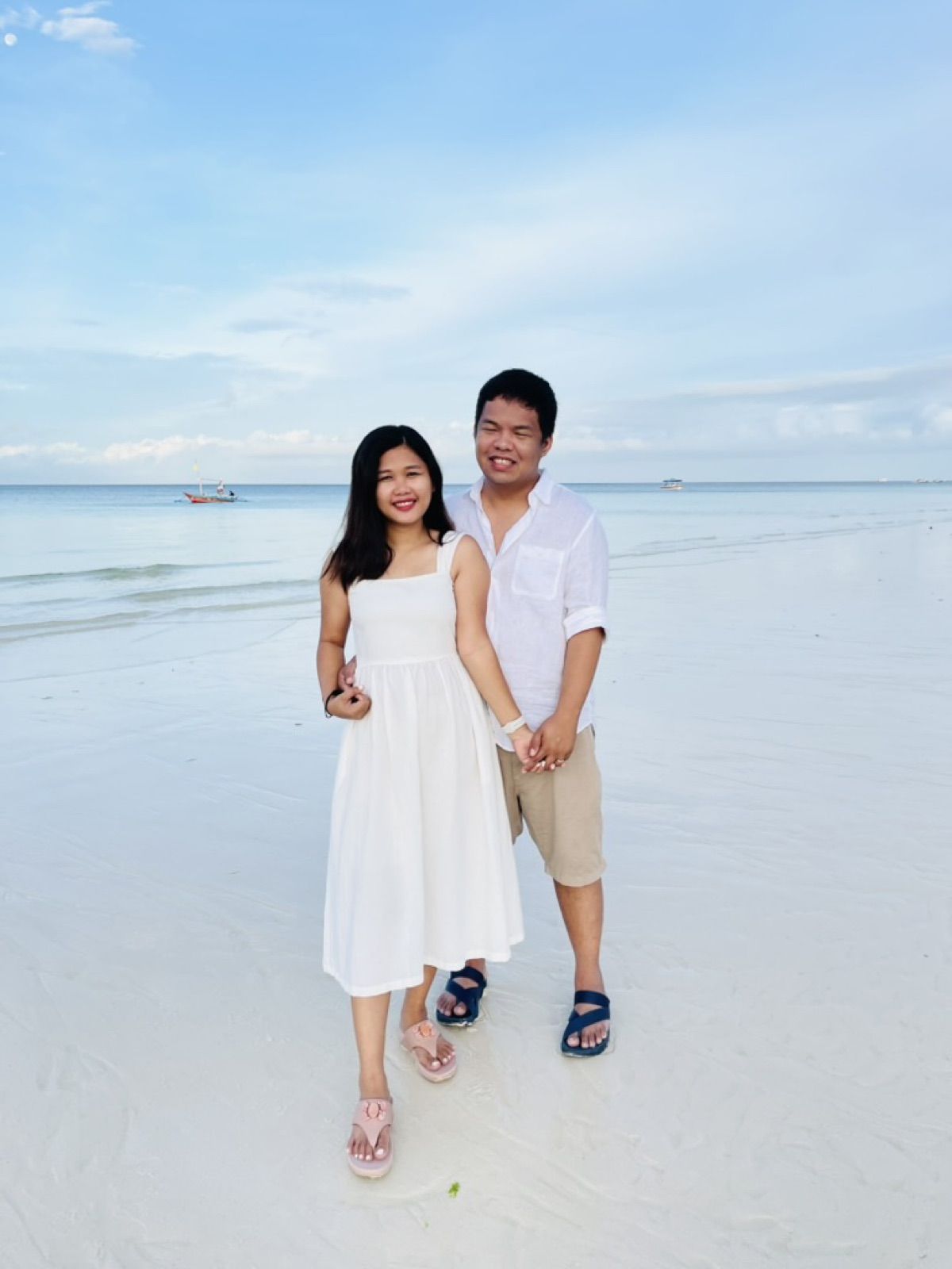 Allanaire and Honhie on a white sand beach